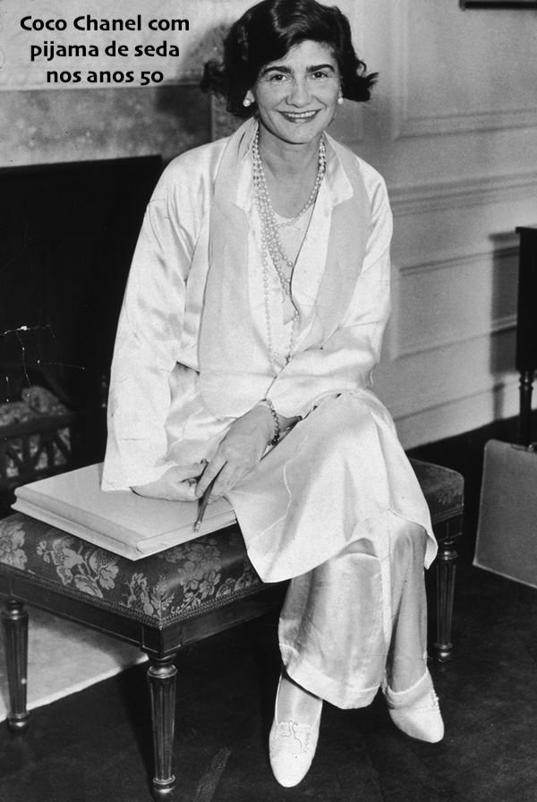 10th March 1931:  Portrait of French fashion designer Gabrielle 'Coco' Chanel (1883 - 1971) posing in her suite at the Hotel Pierre during her first visit to New York City. She wears a white silk jacket and pants with pearls.  (Photo by New York Times Co./Getty Images)